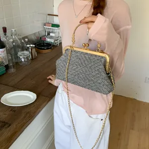 Retro grey tweed shell bag with gold metal handle and chain strap for summer 2025