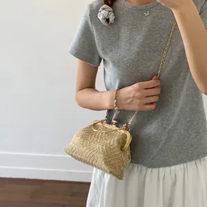 Fashionable beige straw chain crossbody bag with shell design and metal clasp for summer