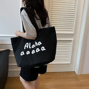 Grand sac cabas en toile noire avec imprimé lettres blanches pour porté épaule décontracté