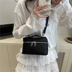 Fashionable black pebble leather crossbody bag with silver hardware for women