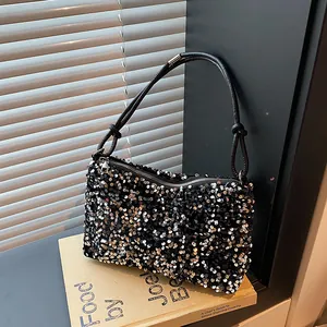 Stylish black sequined crossbody bag for women with metallic details and shoulder strap