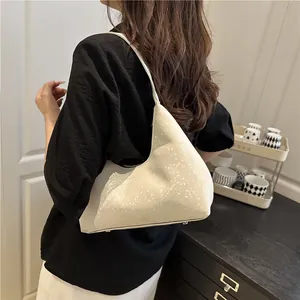Minimalist beige hobo shoulder bag with a sleek triangular design and fashion embossing