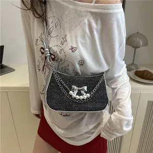 Mini black sequin shoulder bag with pearl bow buckle and silver chain decoration