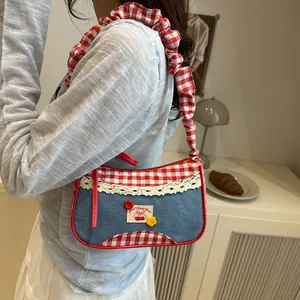 Denim shoulder bag with red plaid ruffles and Sweet Cherry Pie embroidery detail