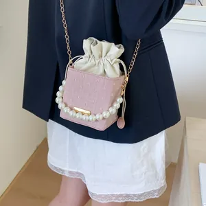 Chic pink jacquard box bag with pearl chain and adjustable gold chain shoulder strap