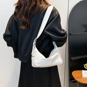 Chic white minimalist crescent shoulder bag for women with wide strap and silver side zip