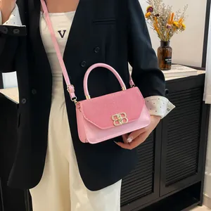 Pink crossbody bag with gold BB buckle and woven texture for elegant daily fashion style