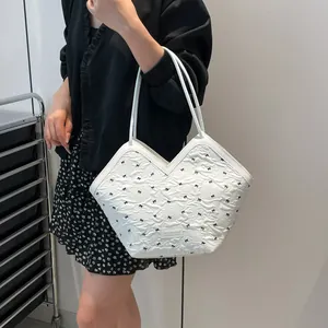 Chic cream tote bag with black bow embroidery and thin shoulder straps for summer