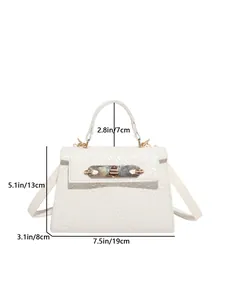 Detail view of woven textured white crossbody bag with dimensions and gold hardware