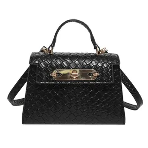 Classic black women's tote bag with diamond pattern embossing and gold hardware