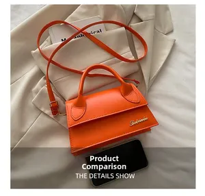 Detailed comparison of orange mini crossbody bag size next to a black smartphone