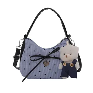 Sweet blue striped tote bag with black bow and cute plush bear charm for women