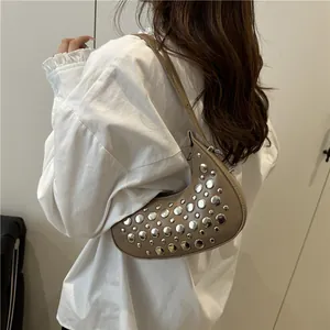 Fashionable khaki crescent shoulder bag featuring stylish silver rivets for women