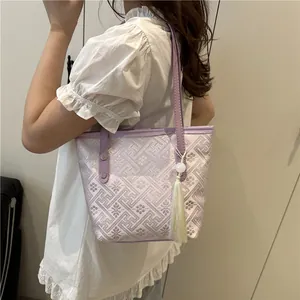 Elegant purple and white tote bag with traditional embroidery and silk tassel charm