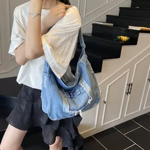 Retro light blue denim hobo bag featuring frayed edges and large capacity for daily use