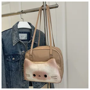 Detail of creative bread cat tote bag with 3D cartoon facial pockets and slim handles