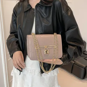 Pink croc-embossed underarm bag with gold chain strap and padlock clasp for women