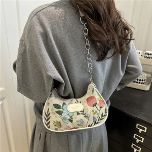 Floral embroidery canvas shoulder bag with silver chain strap and hobo shape design
