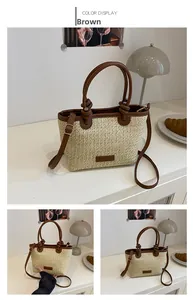 Detailed close-up of brown knot handle and woven texture on a beige straw beach handbag