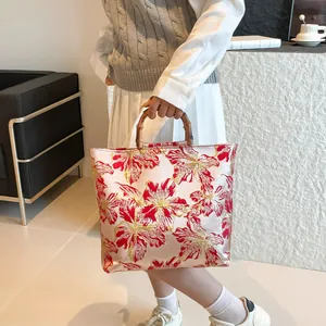 Floral embroidery tote bag with natural bamboo handles and large capacity design