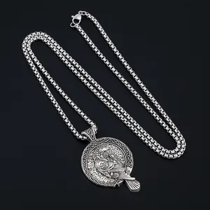 Vintage silver Viking raven pendant necklace with Celtic knot patterns on black background