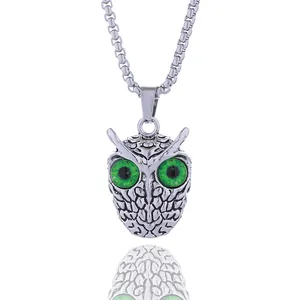 Vintage punk owl pendant necklace with striking green eyes on a silver textured metal chain