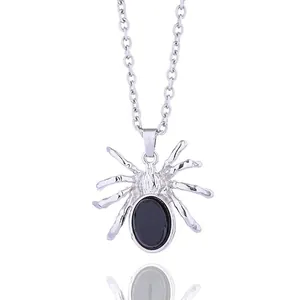 Gothic spider pendant necklace with black gemstone on silver chain in white background
