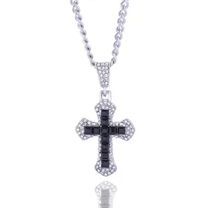 Detailed view of hip hop cross pendant with black square stones and white rhinestones