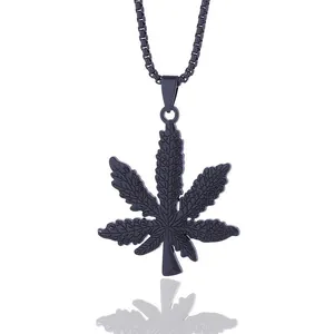 Matte black maple leaf pendant necklace with box chain on a clean white reflective background