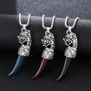Vintage wolf tooth pendant necklace in blue, red, and black with stainless steel wolf head