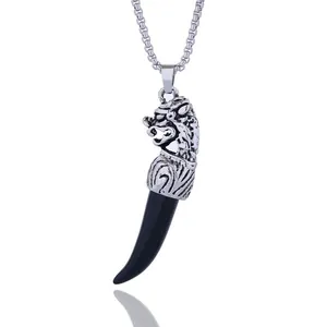 Vintage stainless steel wolf head necklace with a black fang pendant on a box chain