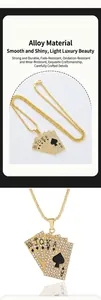 Close-up of golden Ace of Spades poker pendant with white rhinestones on long chain