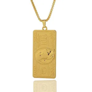 Golden hip-hop 100 dollar bill pendant necklace with thick chain on white background