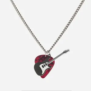 Close-up of punk rock guitar pick necklace with red marble pattern and guitar charm