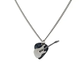 Detailed view of punk rock silver electric guitar and marble-patterned pick pendant