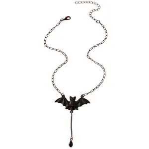 Gothic bat pendant necklace with red gemstone and black teardrop on a fine chain