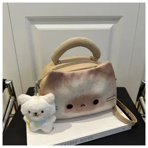 Detail shot of cartoon cat leather shoulder bag with plush face and white kitty pendant