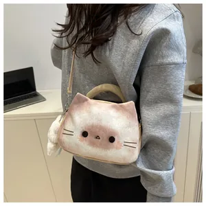 Detailed macro view of soft plush cat-shaped crossbody bag with cute 3D ears and pom-pom charm