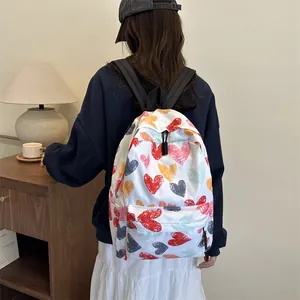 Minimalist school backpack with colorful heart graffiti pattern and adjustable straps