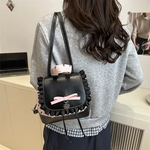 Sac seau noir en cuir style ballet avec nœud rose et bandoulière à motif floral