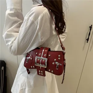 Dark red punk underarm bag with silver studs and metal buckle in Y2K vintage style
