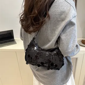 Chic black sequin hobo bag with chain strap and shiny finish for trendy women
