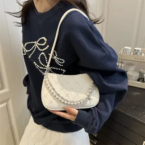 White quilted underarm bag with diamond pattern, pearl and star chain strap for women
