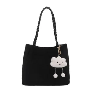 Minimalist black tote bag with braided handles and a cute white cloud plush pendant