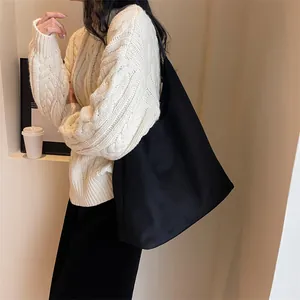 Minimalist large black suede shoulder bag for women with spacious capacity and soft texture