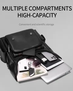 Internal view of black leather backpack showing multiple compartments and high capacity