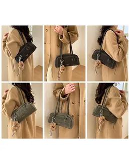 Detail view of retro vintage underarm shoulder bags in coffee and olive green colors