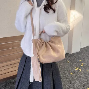 Retro pleated cloud bucket bag with metal ring handle and matching pouch in beige