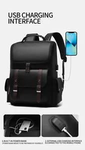 Macro view of the integrated USB charging port and power bank connection on the black backpack