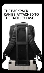 Detailed view of back luggage strap and breathable mesh shoulder straps on black PU backpack